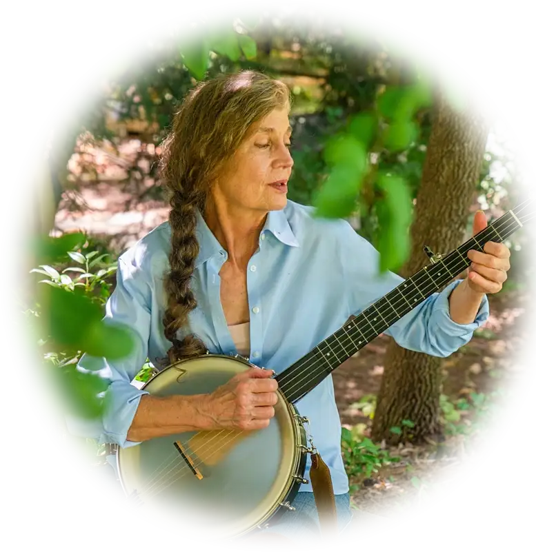 bett padgett plays banjo sitting in garden